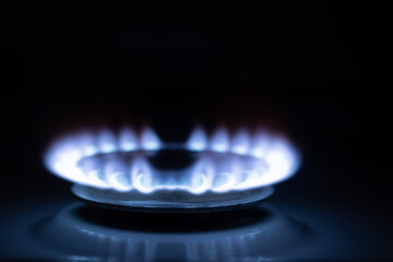 Gas burns with blue flames. Gas crisis around the world. Selective focus on the flame. Soft focus on the picture. Natural gas for housing