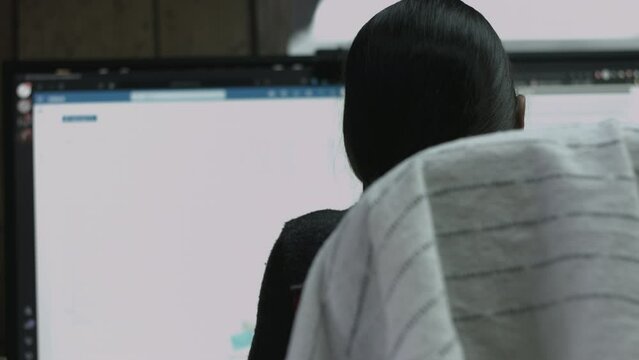 Young Female Office Employee Performs Tasks at Her Desk 4K