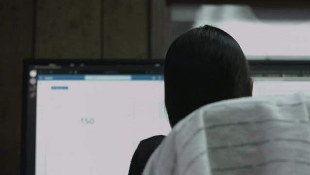 Young Female Office Employee Performs Tasks at Her Desk 4K