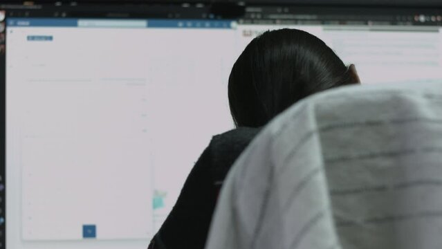 Young Female Office Employee Performs Tasks at Her Desk 4K