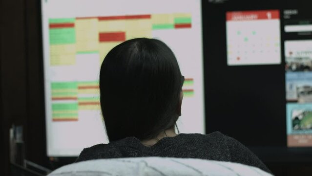 Young Female Office Employee Performs Tasks at Her Desk 4K