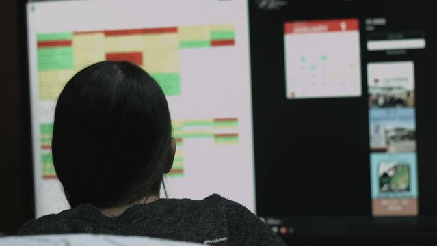 Young Female Office Employee Performs Tasks at Her Desk 4K