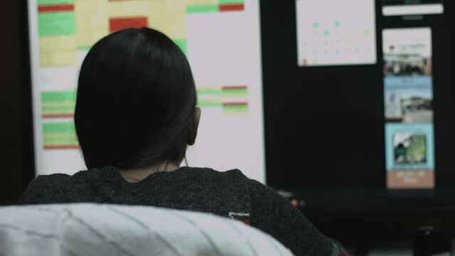 Young Female Office Employee Performs Tasks at Her Desk 4K