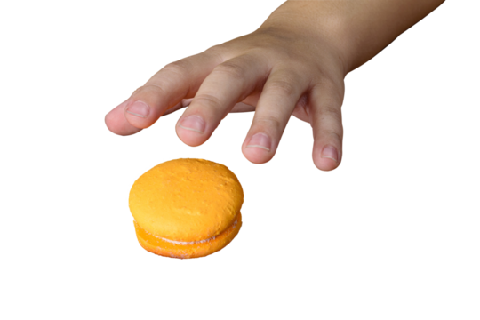 Child's hand going to pick up a yellow macaron (PNG).