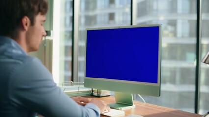 Zoom on ceo looking mockup computer office. Executive typing blue screen device