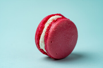 red macaroons on a colored background