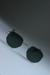 sunglasses on a white background.sunglasses close-up.men's glasses on a white background.women's glasses on a white background.black sunglasses on a white table