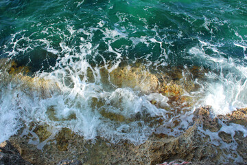 Sea Wave Foam on Rocky Shore
