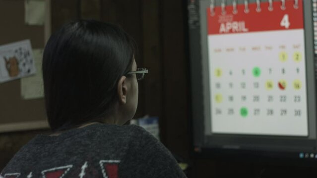 Young Female Office Employee Performs Tasks at Her Desk 4K