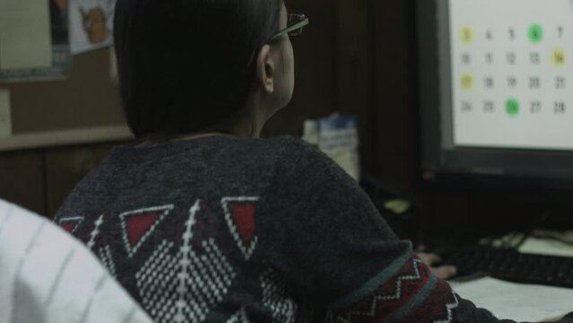 Young Female Office Employee Performs Tasks at Her Desk 4K