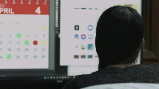 Young Female Office Employee Performs Tasks at Her Desk 4K