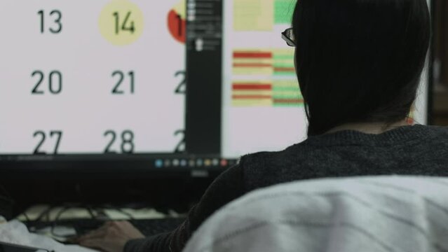 Young Female Office Employee Performs Tasks at Her Desk 4K