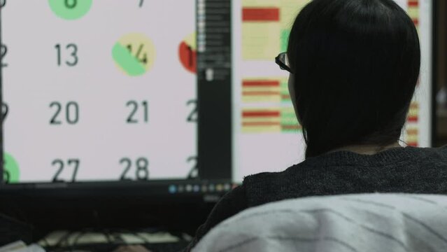 Young Female Office Employee Performs Tasks at Her Desk 4K