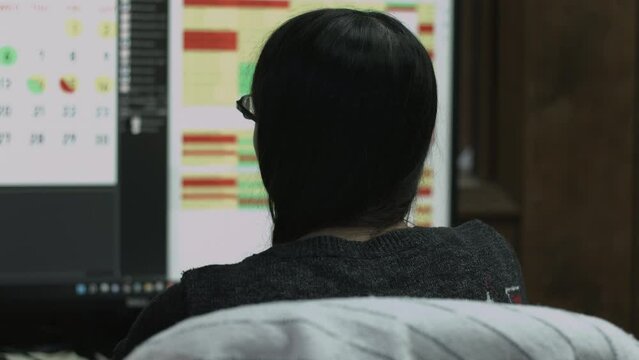 Young Female Office Employee Performs Tasks at Her Desk 4K