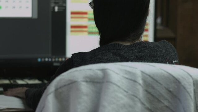 Young Female Office Employee Performs Tasks at Her Desk 4K