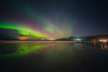 Fototapeta na wymiar Beautiful colorful northern lights captured in the Lofoten Islands in northern Norway.