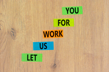 Let us work for you symbol. Concept words Let us work for you on colored paper. Beautiful wooden...