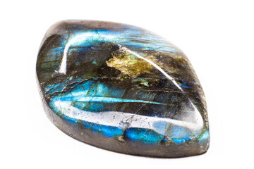 Shiny blue flash labradorite cabochon macro fully isolated on a white background. Blue stone with yellow spots