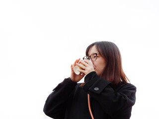 Beautiful Japanese woman drinking a hot coffee outside - 540135101