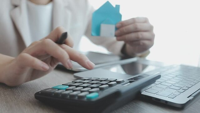 Real estate agent with client or architect team discussing project on tablet computer
