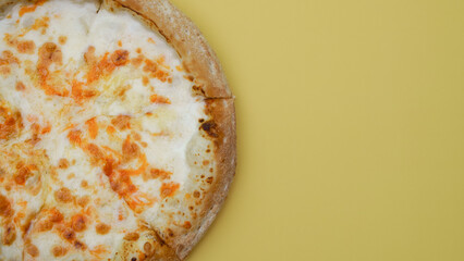 cheese pizza lies on a plain background close-up. minimalist food concept, color combination, copy space, top view