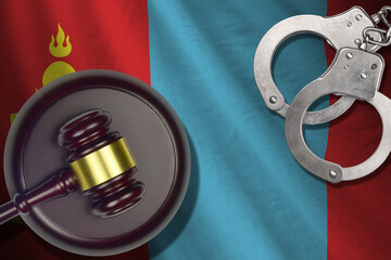 Mongolia flag with judge mallet and handcuffs in dark room. Concept of criminal and punishment,...