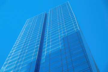 Fototapeta na wymiar Towering apartment or office with cloudless blue sky background in Austin Texas