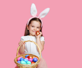 Smiling little girl with Easter eggs in her hand