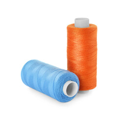 Different colorful sewing threads on white background