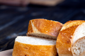 sliced into pieces a long baguette with a crispy crust