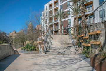 Pathway in San Antonio Texas leading to stairs going up a building entrance