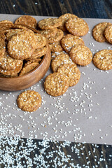oatmeal thin round cookies with lots of sesame seeds