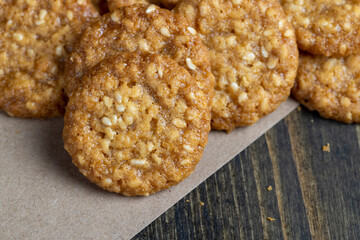 oatmeal thin round cookies with lots of sesame seeds