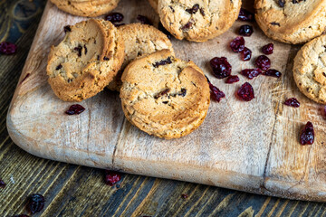 delicious dried cookies made of high-quality flour with dried red cranberries on the table