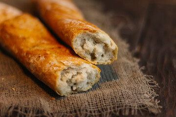 fresh baguettes on a wooden background, pastries