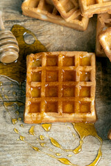 square sweet soft waffles in bee honey
