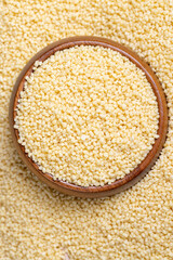 Fresh raw porridge couscous from wheat or millet