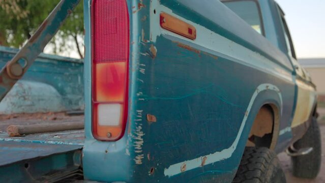 Closeup of an old vintage blue pickup truck