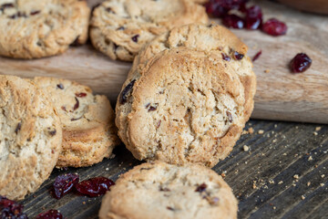 delicious dried cookies made of high-quality flour with dried red cranberries on the table