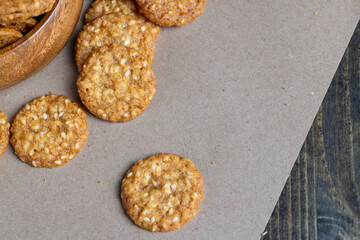 oatmeal thin round cookies with lots of sesame seeds