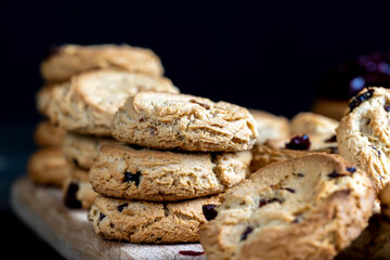 delicious dried cookies made of high-quality flour with dried red cranberries on the table