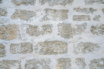 Stone brick wall of an old neglected abandoned building in San Antonio Texas