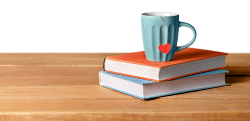 blue cup with red heart on green and orange books on grunge wooden table