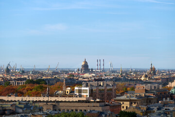 Obraz premium View of the autumn European city from a height. Rooftops of the old city.