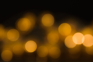 Blurry lights on black. Glowing abstract background