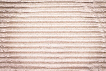 Blank kraft paper texture embossed with horizontal seamless patterns on brown background