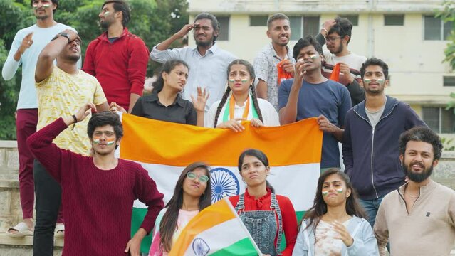 group of audience with Indian flags got sad due to loss of wicket or match while watching cricket at stadium - concpet of negative emotions, championship tournament and competition