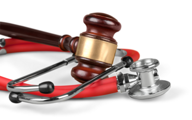 Gavel and stethoscope  on background, symbol photo for bungling and medical error