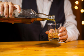 Bartender Serve Whiskey, on wood bar, 