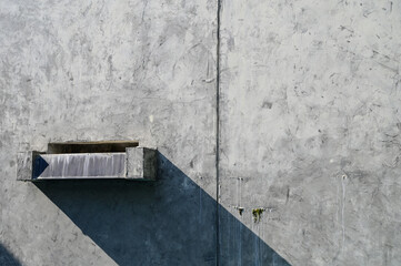 faucet of pool on cement wall background